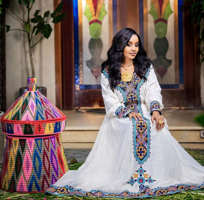 Elegant Habesha Dress with Bold Blue Embroidery for Church Ceremonies and Cultural Events


