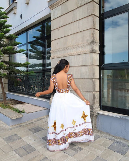 Beautiful Habesha Dress with Intricate Gold and Brown Tibeb For Cultural Event