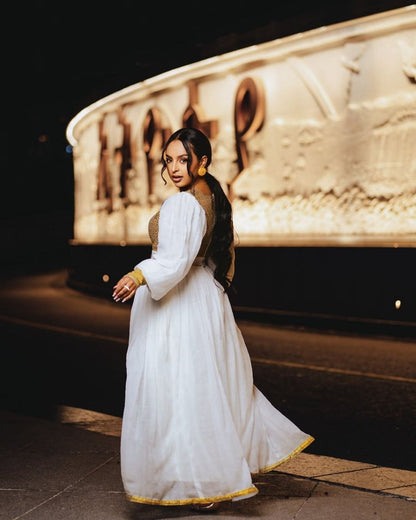 Vibrant Gold Bodice Habesha Dress with Flowing Skirt for an event