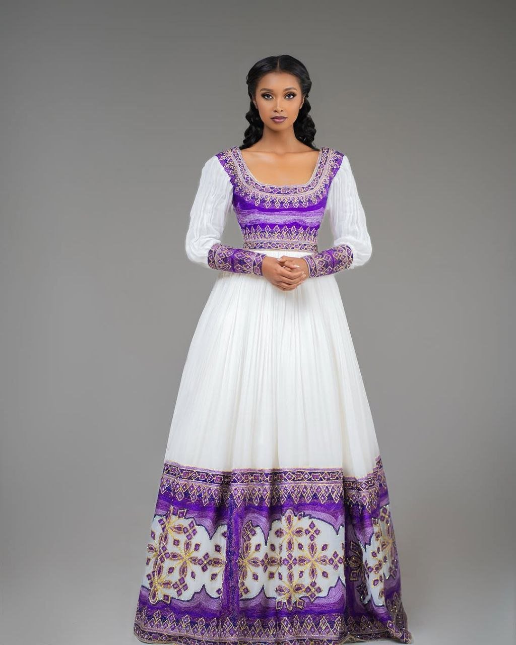 Glamorous Habesha Dress with Intricate Purple Embroidery: A Beautiful Ethiopian Wedding Dress
