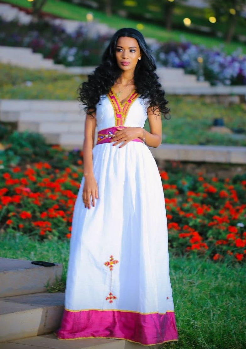 Simple Habesha Dress with Vibrant Pink and Gold Embroidery for Special Occasions
