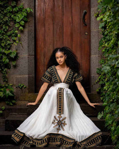 Elegant Traditional Ethiopian Dress with Rich Black and Gold Embroidery for Cultural Celebrations