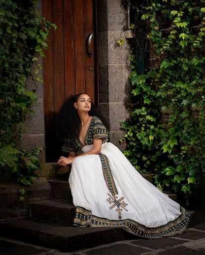 Elegant Traditional Ethiopian Dress with Rich Black and Gold Embroidery for Cultural Celebrations