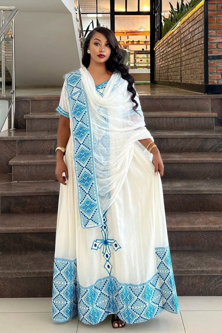Elegant Habesha Dress with Striking Light Blue Embroidery for Cultural Events