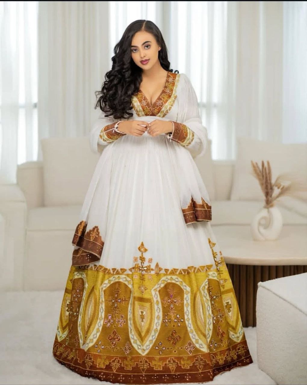 Stunning Habesha Dress with Luxurious Gold Embroidery for Weddings
