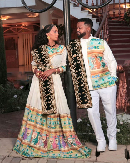 Chic Habesha Couple's Attire with Colorful Embroidery for Celebrations
