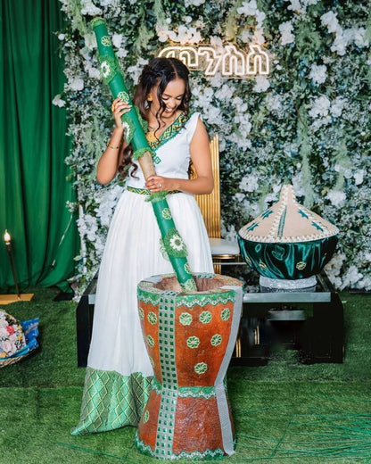 Elegant Habesha Wedding Dress with Stunning Green Embroidery For Celebration
