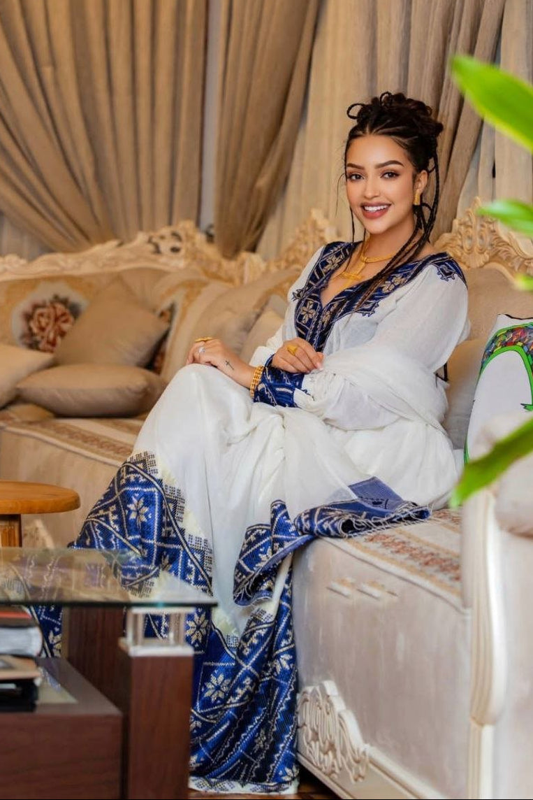 Elegant Habesha Dress with Rich Blue Embroidery for Cultural Events
