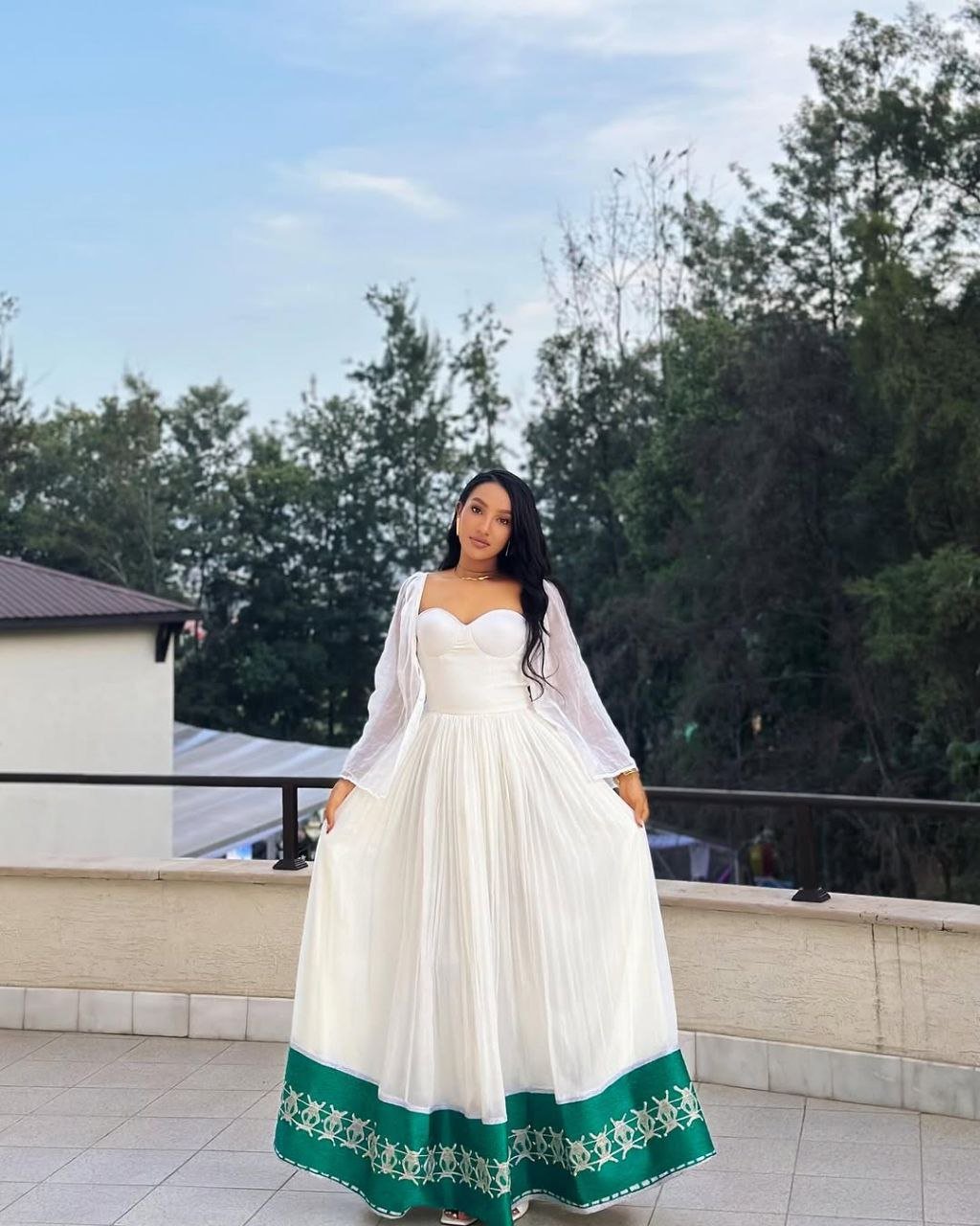 Radiant Habesha Dress with Elegant Green Embroidery a Beautiful Choice for an event
