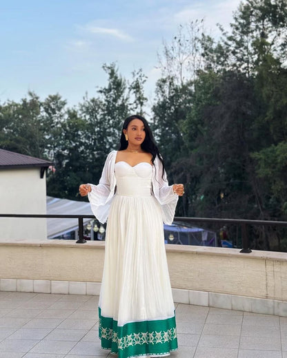 Radiant Habesha Dress with Elegant Green Embroidery a Beautiful Choice for an event