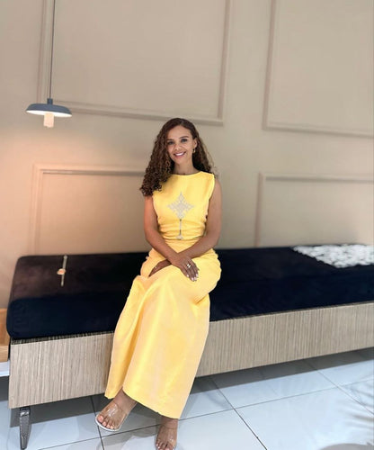 Elegant Yellow Simple Habesha Dress with Subtle Traditional Cross Design For an Event