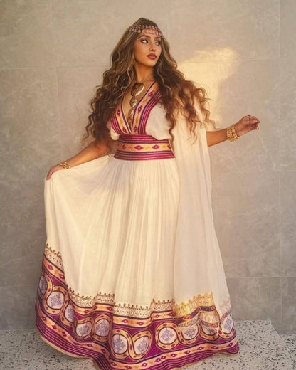 Stylish Habesha Dress with Intricate Purple and Gold Embroidery for an Event
