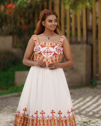 Elegant Habesha Kemis with Vibrant Red and Gold Embroidery for Your Wedding
