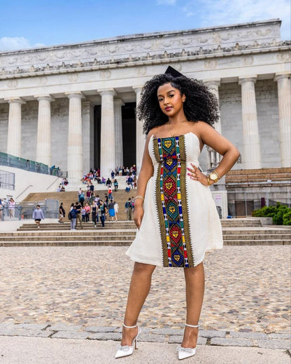 Chic Habesha Kemis with Vibrant Multicolored Embroidery for Celebrations: A Modern Habesha Dress