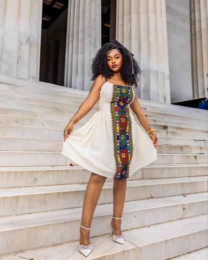 Chic Habesha Kemis with Vibrant Multicolored Embroidery for Celebrations: A Modern Habesha Dress
