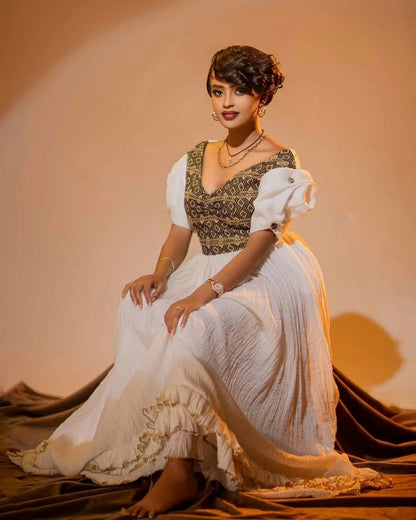 Simple Habesha Kemis with Gold Embroidery for Special Occasions