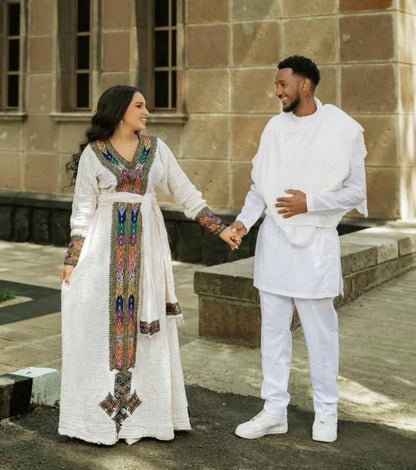 Modern Traditional Ethiopian Couple Outfit – Multicolor Embroidered Habesha Kemis & Men's White Suit