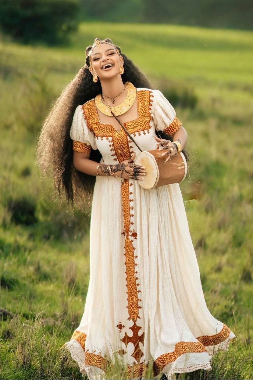 Golden-Embroidered Habesha Kemis  Classic White Ethiopian Cultural Dress