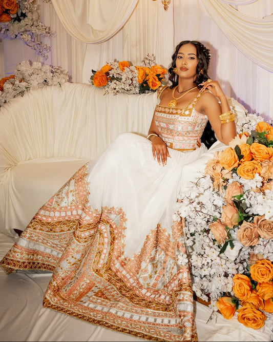 Luxurious Handwoven Habesha Bridal Ensemble with Ornate Golden Embroidery