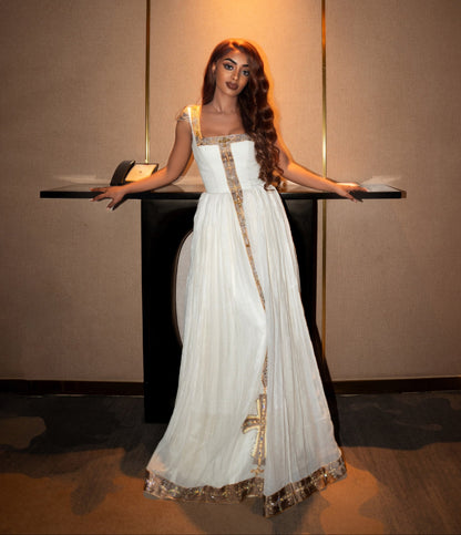 Gold-Trimmed Ethiopian Traditional Dress Regal Cross Embroidery and Timeless Grace Habesha Kemis 1074