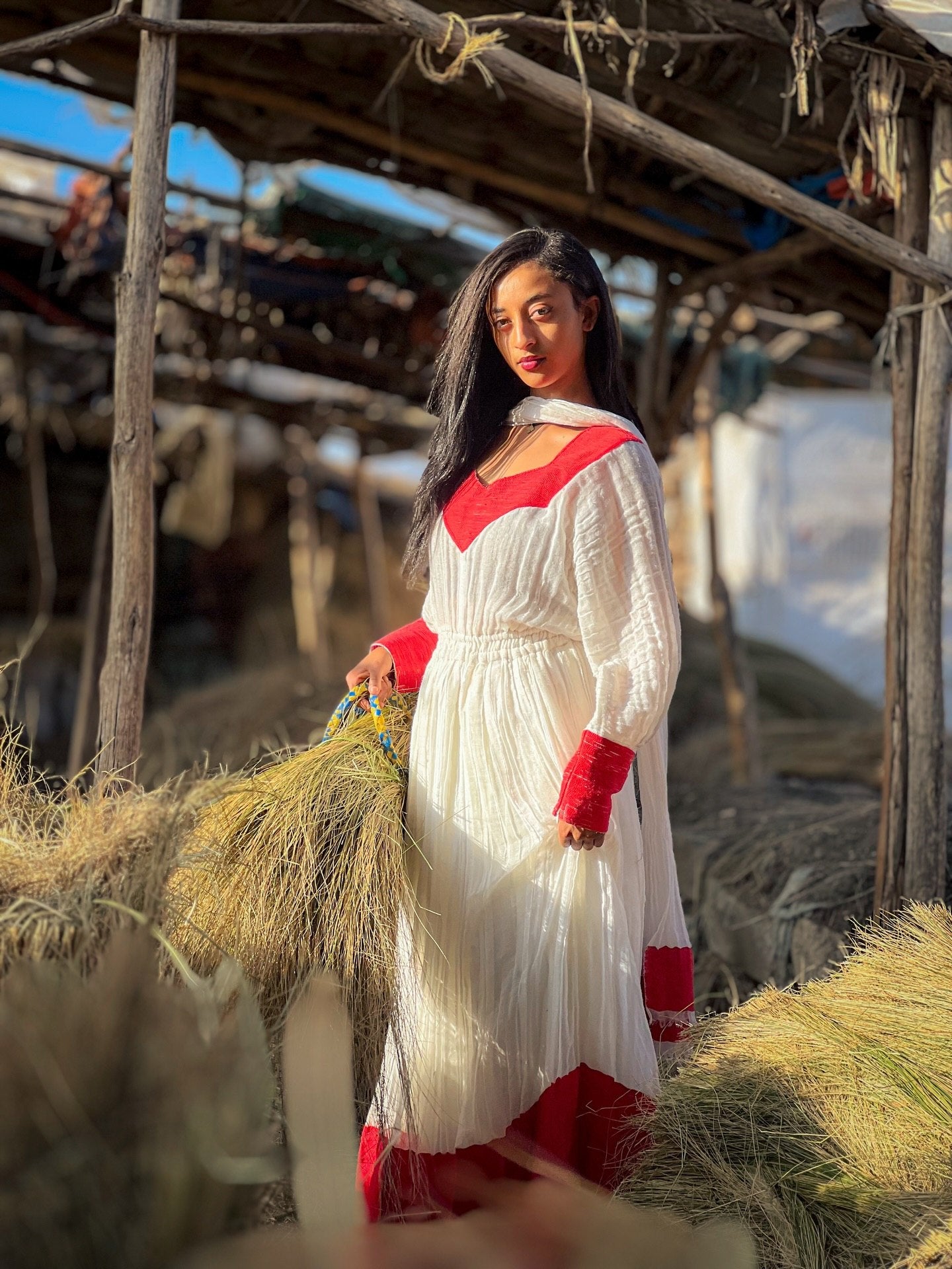 Elegant Ivory and Crimson Habesha Kemis Flowing Pleats, Bold Traditional Accents, and Timeless Ethiopian Dress 1089