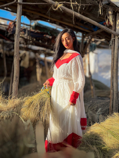 Elegant Ivory and Crimson Habesha Kemis Flowing Pleats, Bold Traditional Accents, and Timeless Ethiopian Dress 1089