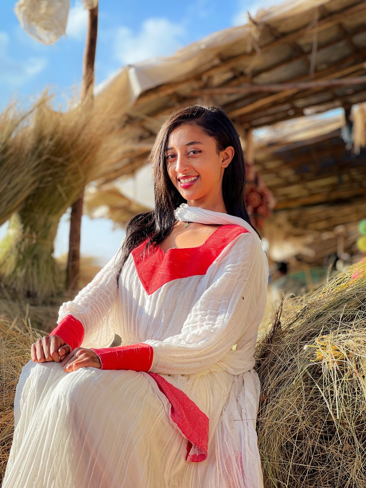 Elegant Ivory and Crimson Habesha Kemis Flowing Pleats, Bold Traditional Accents, and Timeless Ethiopian Dress 1089