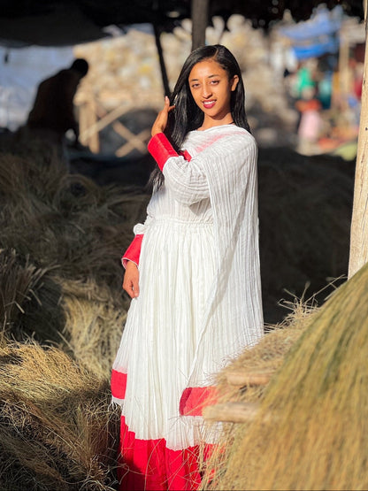 Elegant Ivory and Crimson Habesha Kemis Flowing Pleats, Bold Traditional Accents, and Timeless Ethiopian Dress 1089