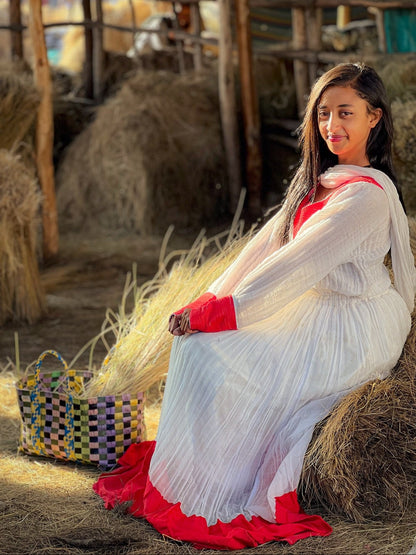 Elegant Ivory and Crimson Habesha Kemis Flowing Pleats, Bold Traditional Accents, and Timeless Ethiopian Dress 1089