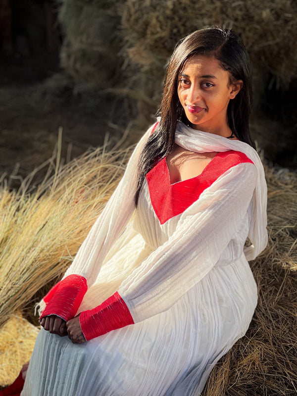 Elegant Ivory and Crimson Habesha Kemis Flowing Pleats, Bold Traditional Accents, and Timeless Ethiopian Dress 1089