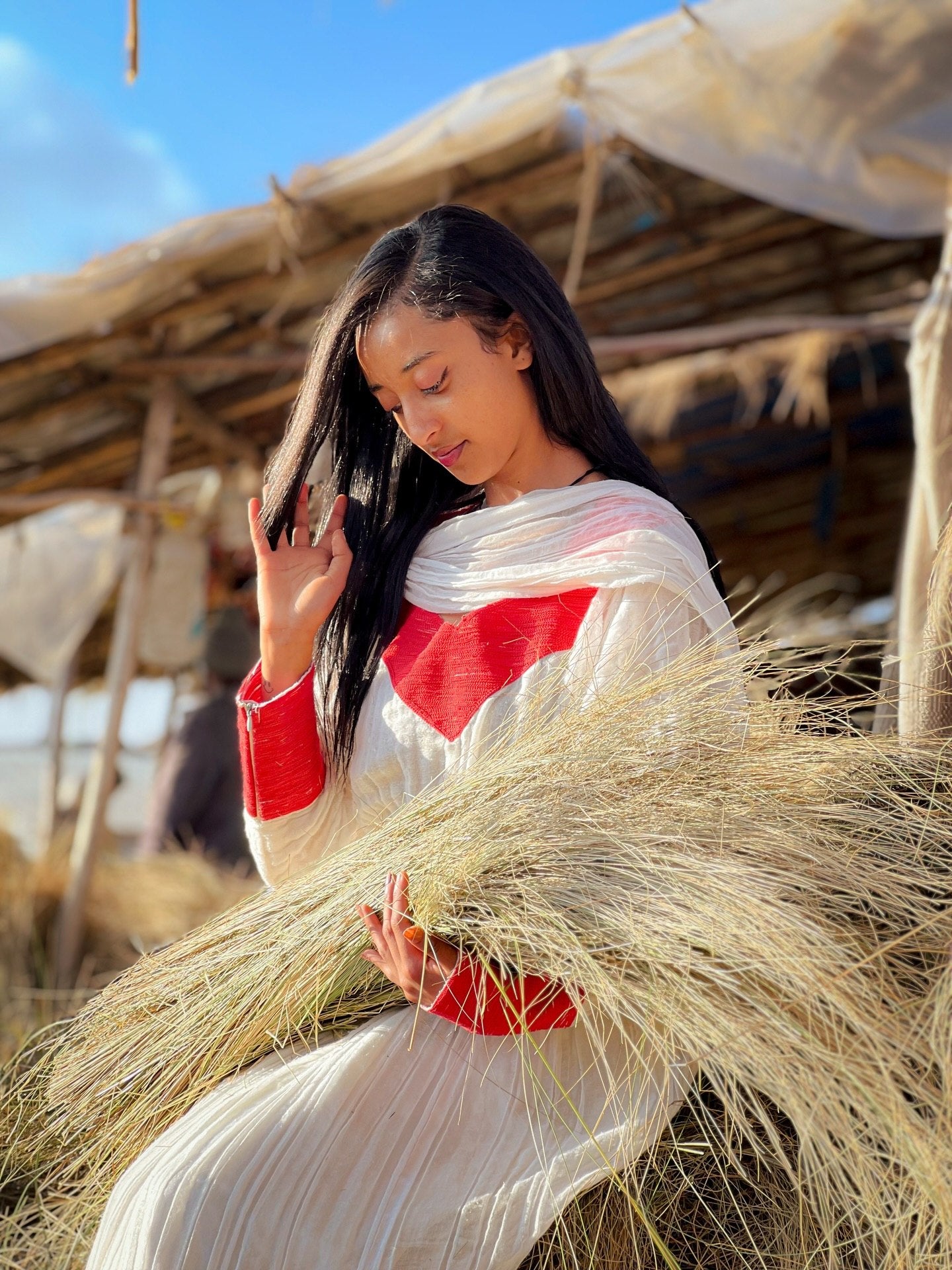 Elegant Ivory and Crimson Habesha Kemis Flowing Pleats, Bold Traditional Accents, and Timeless Ethiopian Dress 1089