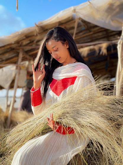 Elegant Ivory and Crimson Habesha Kemis Flowing Pleats, Bold Traditional Accents, and Timeless Ethiopian Dress 1089