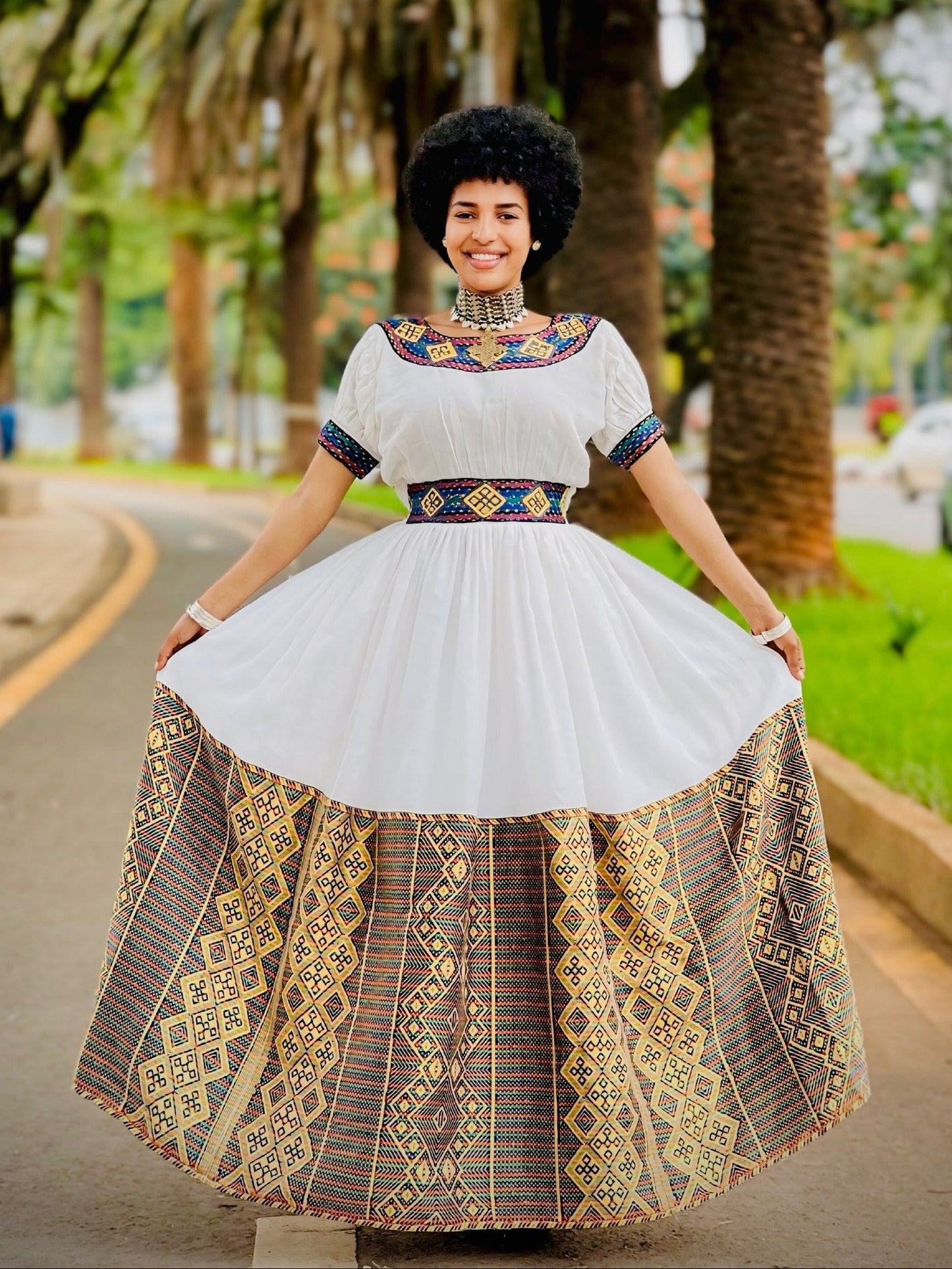 Regal Ethiopian Habesha Ensemble with Vibrant Geometric Woven Details