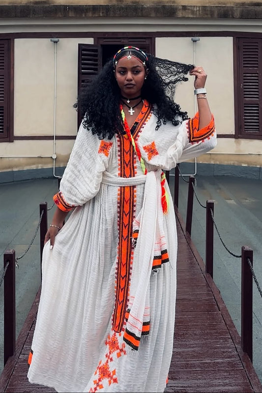 Traditional White Ethiopian Dress with Orange Tibeb Patterns