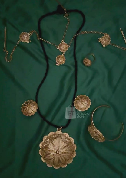 5-piece Round Shaped Golden Ethiopian Jewelry Set Habesha Jewelry Including Black Thread Chained Necklace, Earrings, Rings. Bracelet and Headpiece