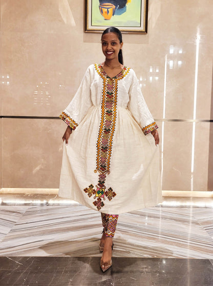 Vibrant Elegance: Pink and Orange Embroidered Habesha Dress – Celebrate Ethiopian & Eritrean Culture with this Stunning Masterpiece